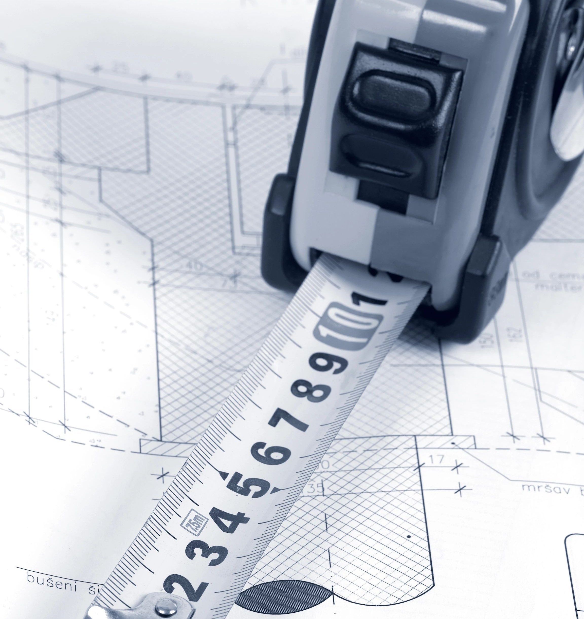 Tape measure on blueprints - Free in-home estimates from Carpet Villa in Grand Rapids, MI